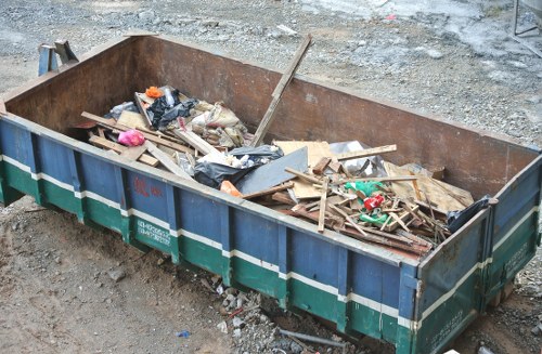 Construction site with builders waste being cleared in Spitalfields